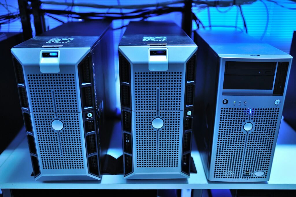 our services Close-up view of modern rack-mounted server units in a data center.